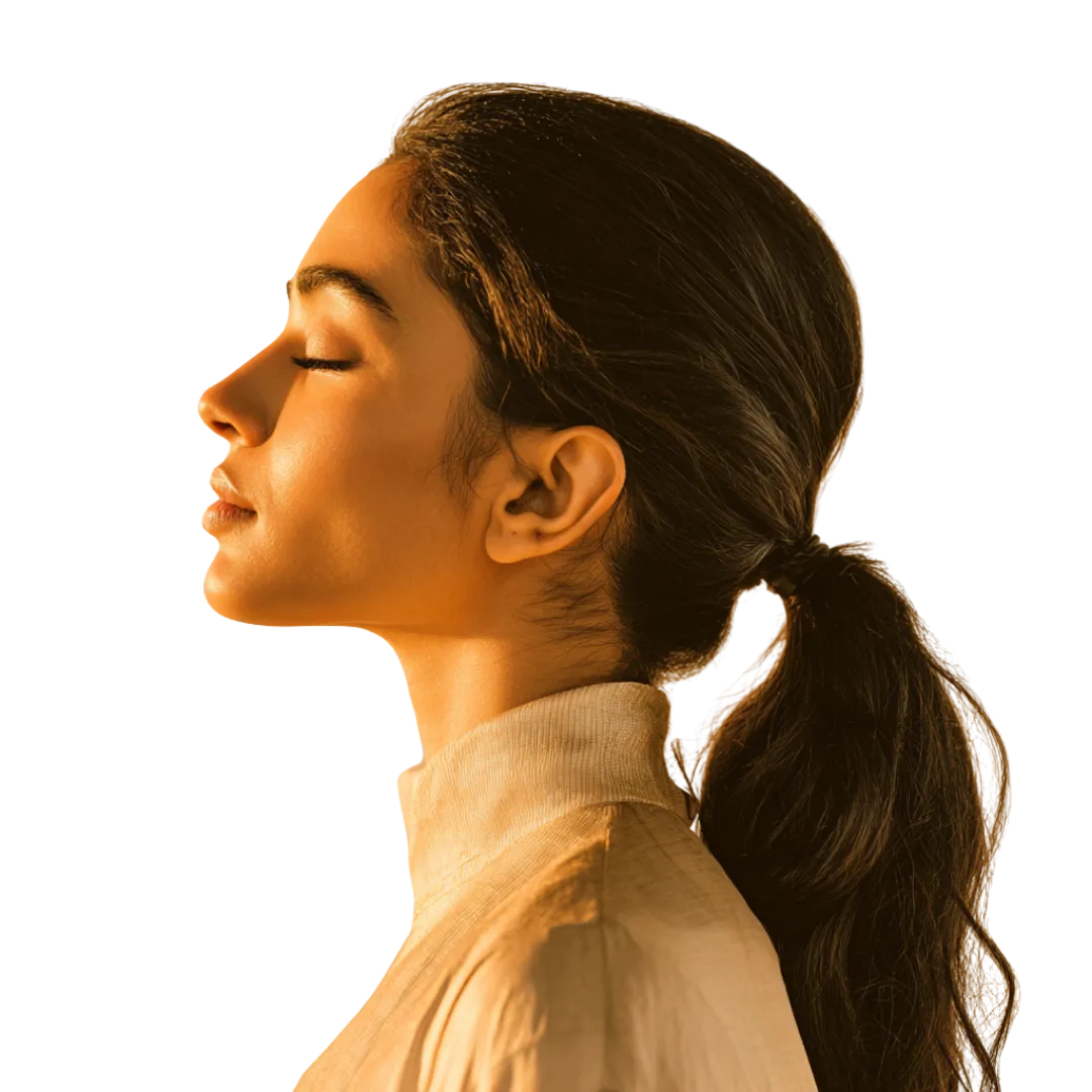 Woman with closed eyes in warm lighting